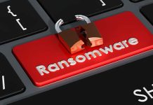 Ransomware red button on keyboard, 3D rendering